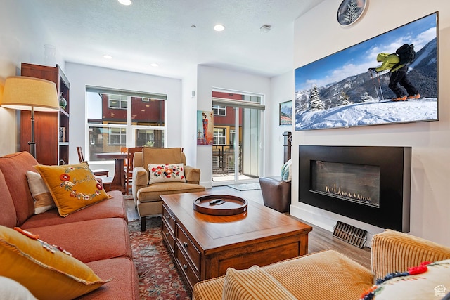 1370 Center Dr Unit 17, Kimball Junction, UT 84098 - living area featuring a glass covered fireplace and recessed lighting