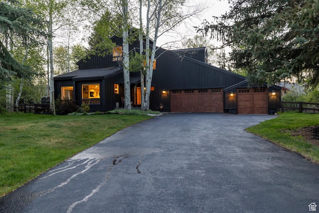 2126 Twilight Ct, Park City, UT 84060 - view of front of house with board and batten siding, asphalt driveway, and an attached garage
