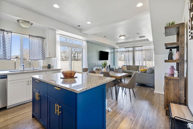 723 E 380 S, American Fork, UT 84003 - kitchen featuring blue cabinetry, a sink, healthy amount of natural light, white cabinets, and recessed lighting