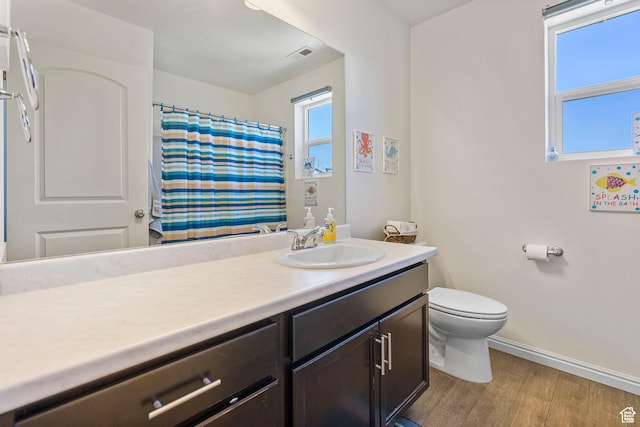 723 E 380 S, American Fork, UT 84003 - full bathroom featuring baseboards, wood finished floors, toilet, vanity, and curtained shower