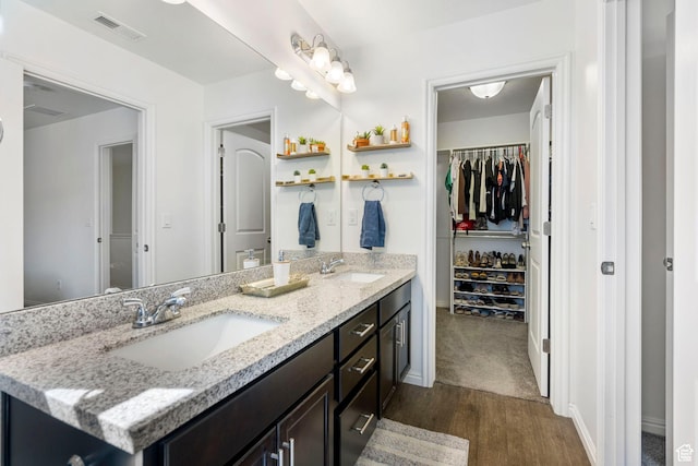 723 E 380 S, American Fork, UT 84003 - bathroom with wood finished floors, double vanity, a spacious closet, and baseboards