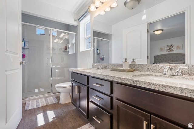 723 E 380 S, American Fork, UT 84003 - bathroom with wood finished floors, toilet, double vanity, a shower stall, and plenty of natural light