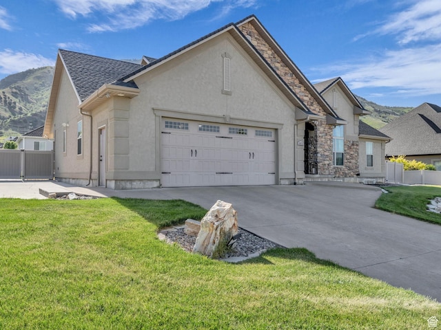 1872 N 1850 E, North Logan, UT 84341 - french provincial home with stucco siding, a garage, concrete driveway, and stone siding