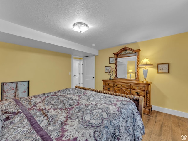 1872 N 1850 E, North Logan, UT 84341 - bedroom with wood finished floors, a textured ceiling, and baseboards
