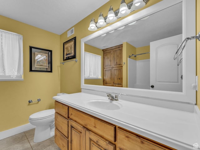 1872 N 1850 E, North Logan, UT 84341 - full bathroom with toilet, vanity, tile patterned flooring, baseboards, and a shower