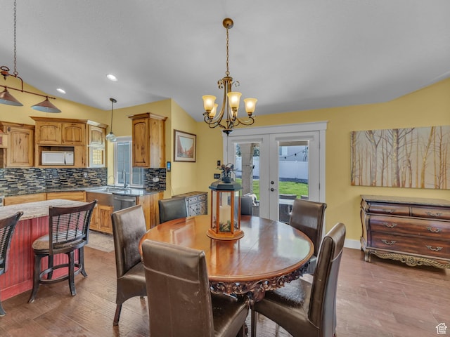 1872 N 1850 E, North Logan, UT 84341 - dining space featuring french doors, a chandelier, wood finished floors, recessed lighting, and baseboards