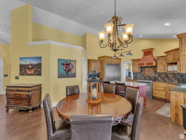 1872 N 1850 E, North Logan, UT 84341 - dining area featuring dark wood-style floors, a chandelier, high vaulted ceiling, and baseboards