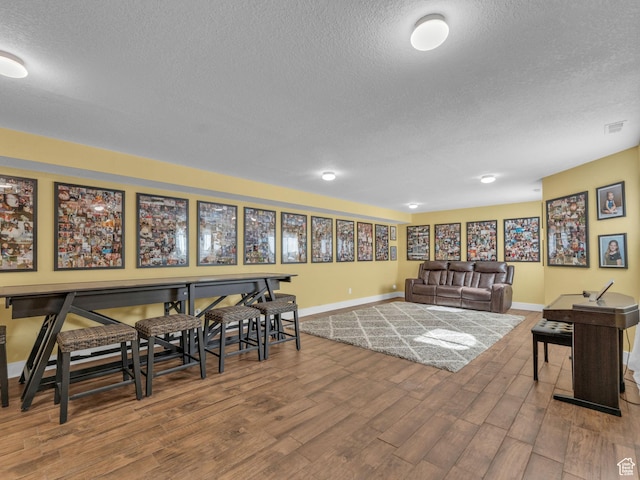 1872 N 1850 E, North Logan, UT 84341 - dining space featuring a textured ceiling, baseboards, and wood finished floors