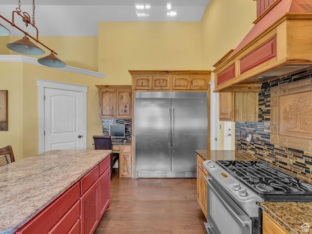 1872 N 1850 E, North Logan, UT 84341 - kitchen with stainless steel appliances, a towering ceiling, decorative backsplash, light stone counters, and dark wood-style floors