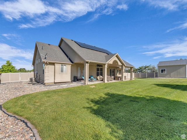 1872 N 1850 E, North Logan, UT 84341 - rear view of house featuring an outdoor living space, solar panels, a patio area, cooling unit, and roof with shingles