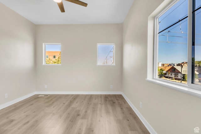 185 W 700 S Unit 101, Salt Lake City, UT 84101 - unfurnished room featuring plenty of natural light, ceiling fan, and light wood-style flooring