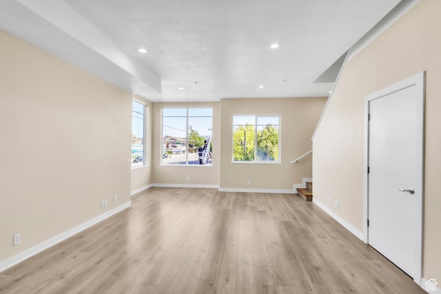 185 W 700 S Unit 101, Salt Lake City, UT 84101 - unfurnished living room featuring light wood-style flooring, stairway, recessed lighting, and baseboards