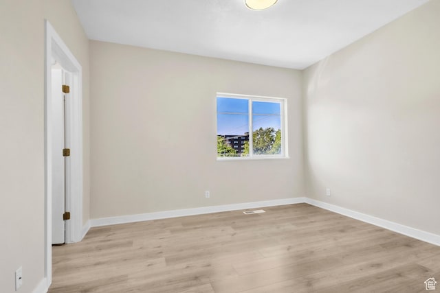 185 W 700 S Unit 101, Salt Lake City, UT 84101 - unfurnished room featuring light wood-style flooring and baseboards