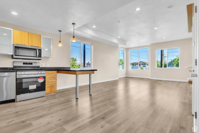 185 W 700 S Unit 101, Salt Lake City, UT 84101 - kitchen featuring appliances with stainless steel finishes, light wood finished floors, recessed lighting, dark countertops, and pendant lighting