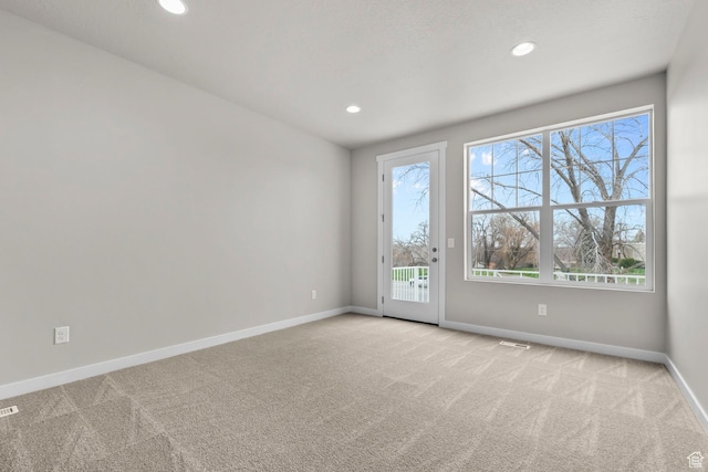 746 W Signal Dr, Salt Lake City, UT 84123 - unfurnished room featuring light carpet, baseboards, and recessed lighting