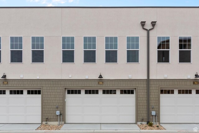 746 W Signal Dr, Salt Lake City, UT 84123 - view of front of property featuring stucco siding and an attached garage
