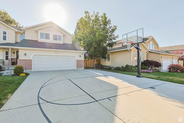 9574 S Equestrian Park Cir, Sandy, UT 84092 - view of front of house featuring driveway, stucco siding, and brick siding