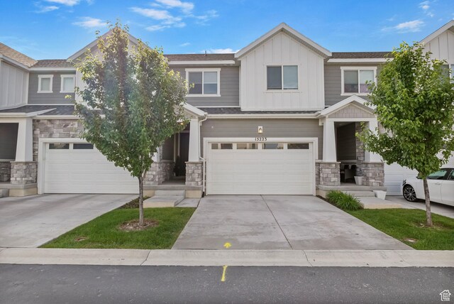 15223 S Wild Horse Way, Bluffdale, UT 84065 - craftsman inspired home with stone siding, an attached garage, board and batten siding, and driveway