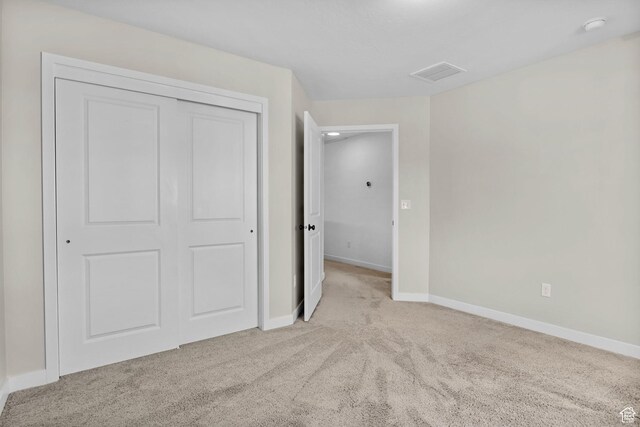15223 S Wild Horse Way, Bluffdale, UT 84065 - unfurnished bedroom featuring carpet flooring, a closet, and baseboards