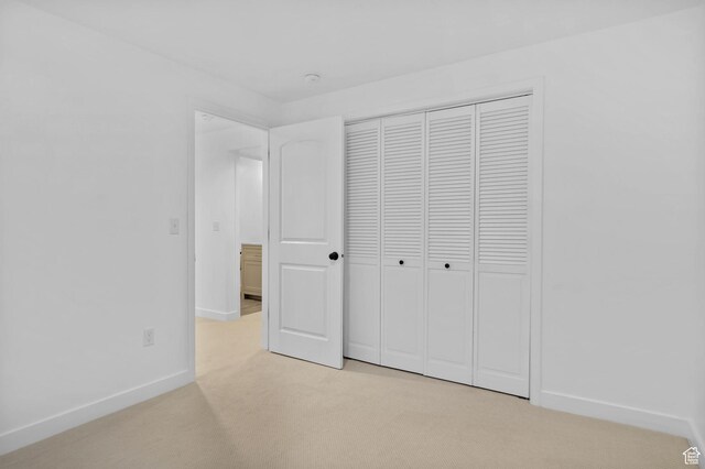 15223 S Wild Horse Way, Bluffdale, UT 84065 - unfurnished bedroom with light carpet, baseboards, and a closet
