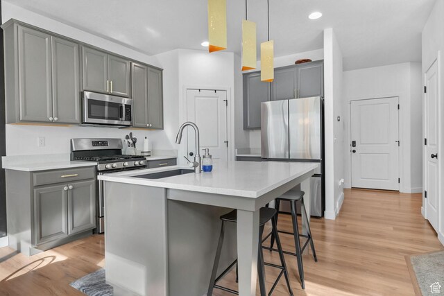 15223 S Wild Horse Way, Bluffdale, UT 84065 - kitchen featuring appliances with stainless steel finishes, a sink, gray cabinetry, and recessed lighting