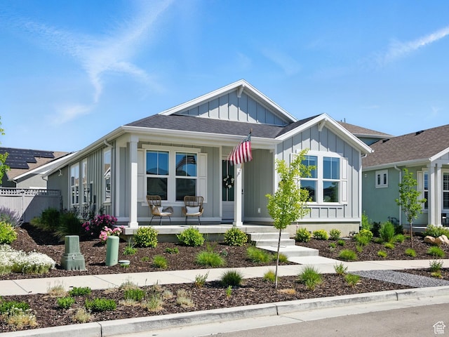 6034 W Sparrow View Dr, South Jordan, UT 84009 - view of front facade with covered porch and board and batten siding