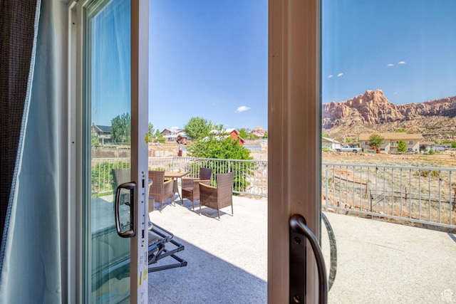 740 W Uzona Ave, Hildale, UT 84784 - doorway to outside featuring french doors, carpet, and a mountain view