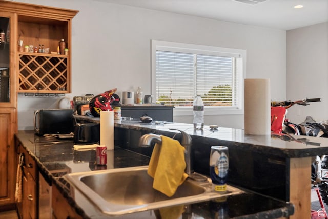 740 W Uzona Ave, Hildale, UT 84784 - kitchen with recessed lighting, brown cabinets, and dark countertops