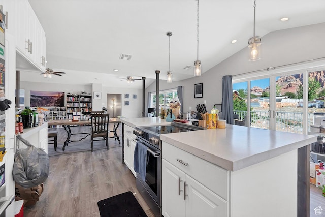 740 W Uzona Ave, Hildale, UT 84784 - kitchen featuring stainless steel electric range oven, lofted ceiling, ceiling fan, white cabinetry, and open floor plan