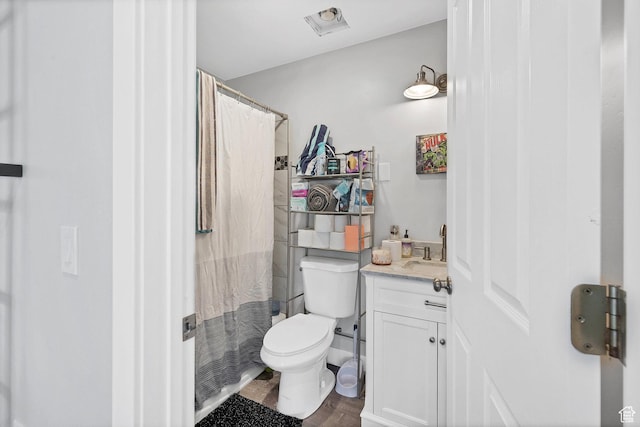 740 W Uzona Ave, Hildale, UT 84784 - bathroom featuring toilet, vanity, wood finished floors, and a shower with shower curtain