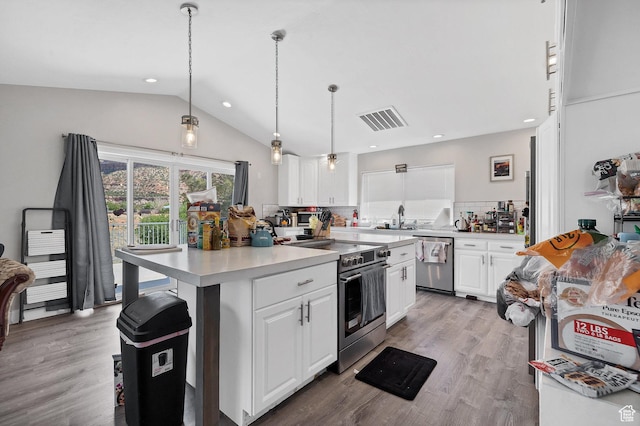 740 W Uzona Ave, Hildale, UT 84784 - kitchen featuring appliances with stainless steel finishes, a sink, white cabinets, tasteful backsplash, and light countertops