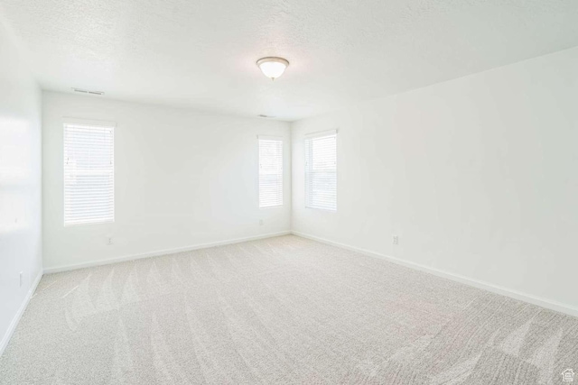 2199 W 650 S, Lehi, UT 84043 - spare room with baseboards, light colored carpet, and a textured ceiling