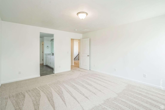 2199 W 650 S, Lehi, UT 84043 - unfurnished bedroom featuring light carpet, baseboards, and ensuite bath