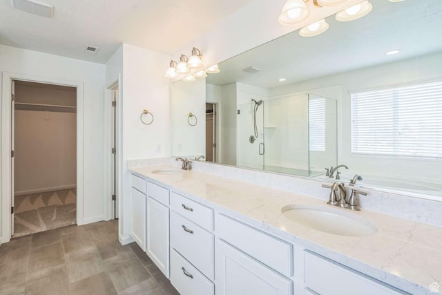 2199 W 650 S, Lehi, UT 84043 - bathroom featuring a spacious closet, a stall shower, double vanity, and a garden tub