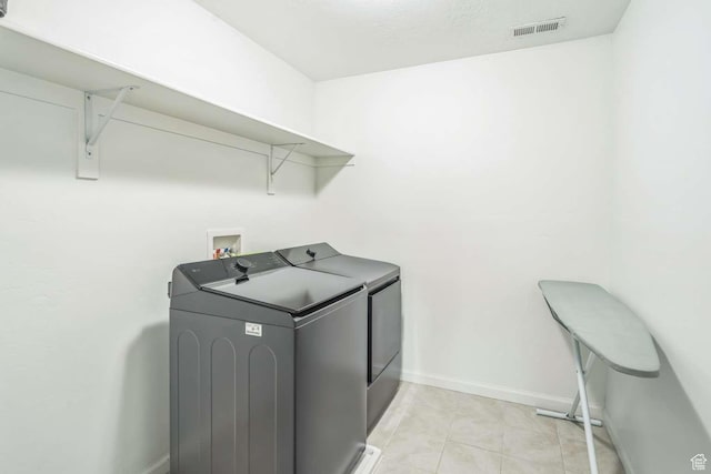 2199 W 650 S, Lehi, UT 84043 - laundry area with washer and clothes dryer, baseboards, and light tile patterned floors