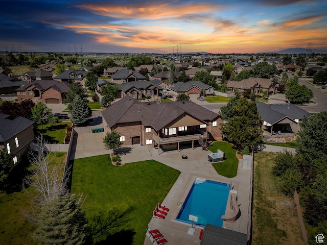 2632 S 2975 W, West Haven, UT 84401 - aerial view at dusk of a residential view and view of pool