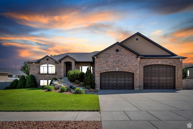 2632 S 2975 W, West Haven, UT 84401 - french provincial home with driveway, a yard, an attached garage, and brick siding