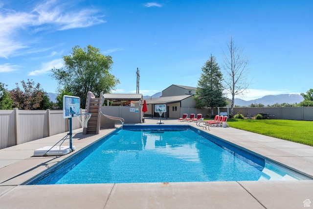 2632 S 2975 W, West Haven, UT 84401 - view of swimming pool with a water slide, a patio, and a mountain view