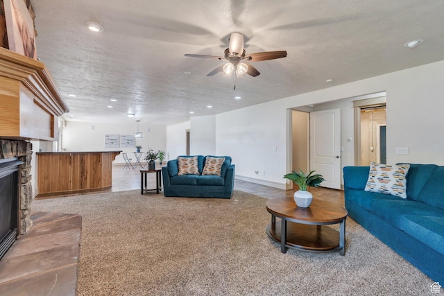2632 S 2975 W, West Haven, UT 84401 - living room with ceiling fan, a stone fireplace, recessed lighting, carpet floors, and baseboards