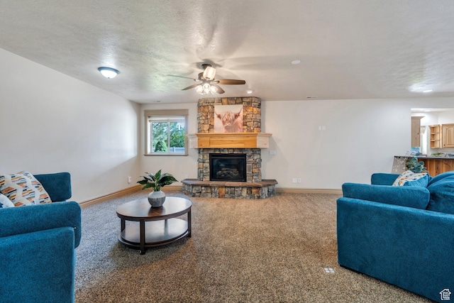 2632 S 2975 W, West Haven, UT 84401 - living area with a ceiling fan, a fireplace, baseboards, carpet floors, and a textured ceiling