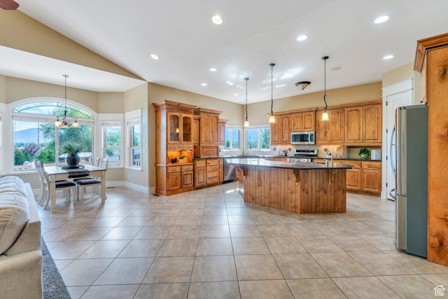 2632 S 2975 W, West Haven, UT 84401 - kitchen with stainless steel appliances, open floor plan, a kitchen island, recessed lighting, and brown cabinetry