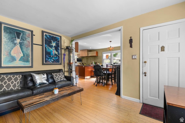 1451 E Redondo, Salt Lake City, UT 84105 - living area featuring light wood-style floors, a chandelier, and baseboards