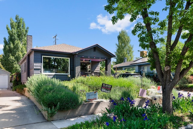 1451 E Redondo, Salt Lake City, UT 84105 - view of front facade with a chimney, brick siding, and driveway