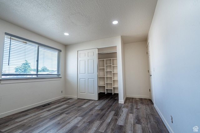 3309 S 8000 W, Magna, UT 84044 - unfurnished bedroom featuring a textured ceiling, wood finished floors, a closet, baseboards, and recessed lighting