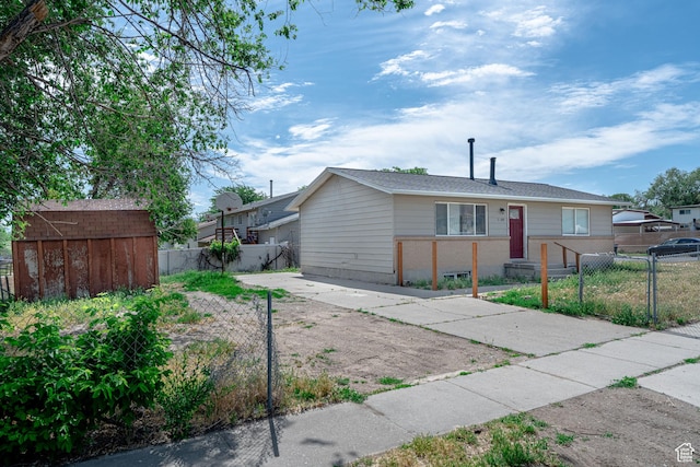 3309 S 8000 W, Magna, UT 84044 - single story home with a fenced front yard and brick siding