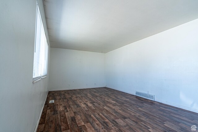 3309 S 8000 W, Magna, UT 84044 - unfurnished room with dark wood-style floors and baseboards