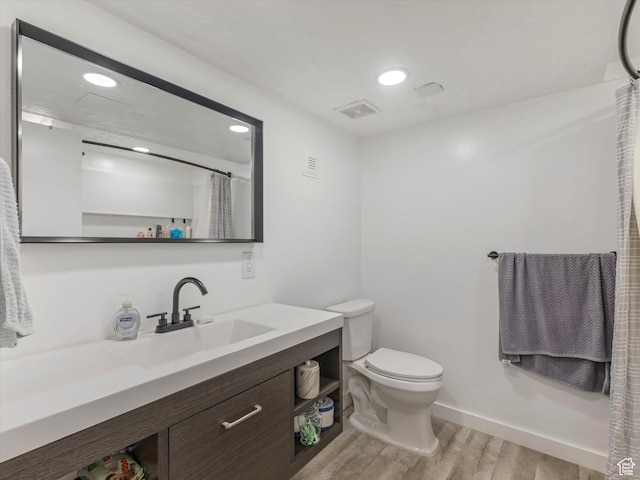 3951 S 875 E Unit 25, Ogden, UT 84403 - bathroom with wood finished floors, vanity, toilet, recessed lighting, and a shower with shower curtain