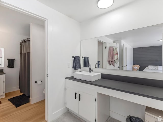 3951 S 875 E Unit 25, Ogden, UT 84403 - full bathroom featuring vanity, wood finished floors, and baseboards