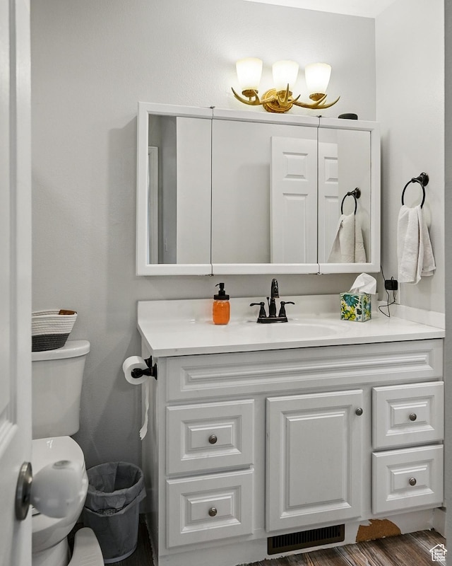 1790 E Homestead, Enoch, UT 84721 - bathroom featuring vanity, toilet, and wood finished floors