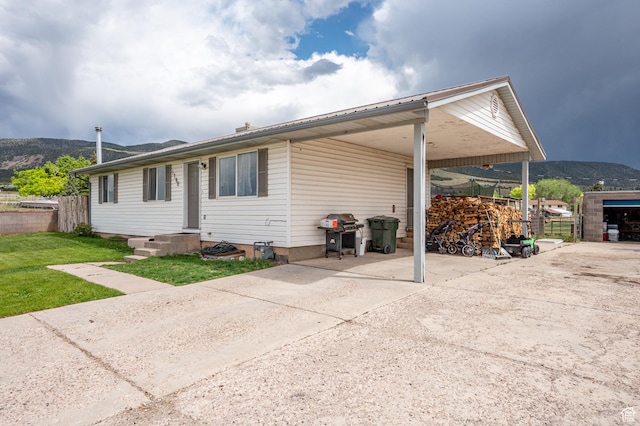 1790 E Homestead, Enoch, UT 84721 - rear view of property featuring a carport